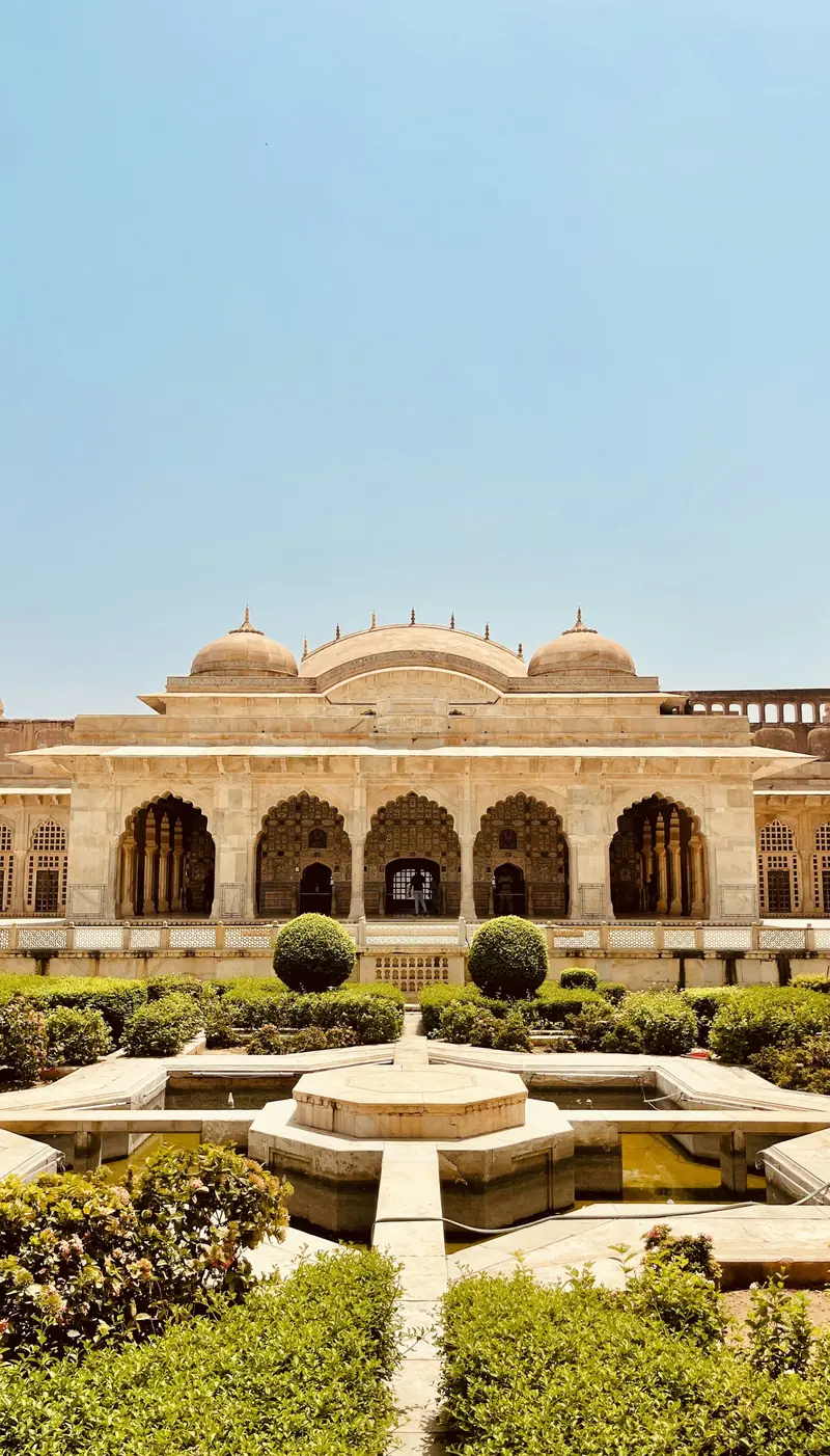 A formal garden and pavilion inside Amber Fort