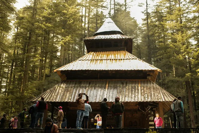 The wooden pagoda-roofed Hadimba Devi Temple among deodar trees in Manali