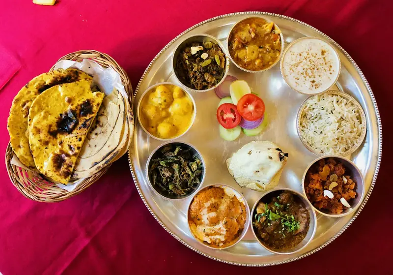 A vegetarian thali with dals, vegetables, rice and rotis