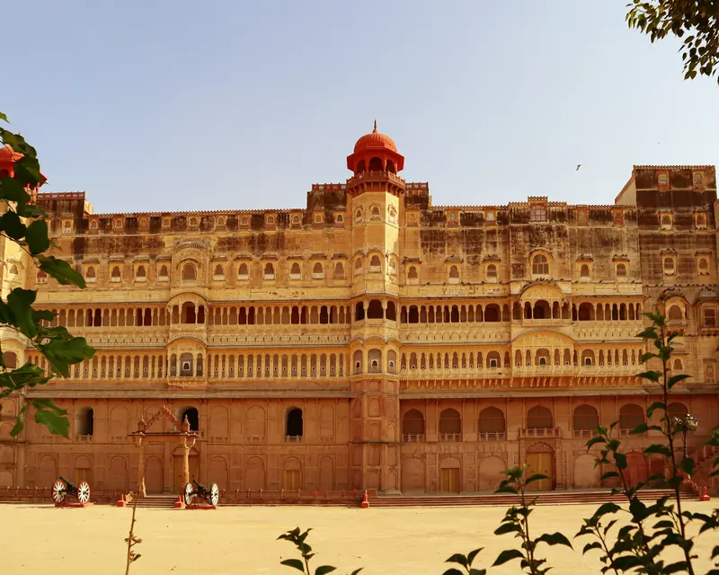 A carved red sandstone palace facade inside Junagarh Fort, Bikaner
