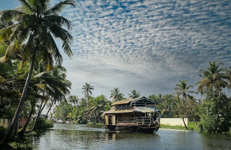 A traditional houseboat on the palm-fringed backwaters of Kerala