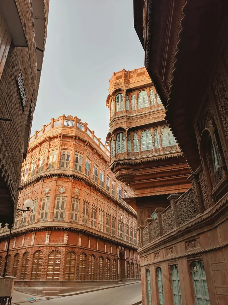 Red sandstone Rampuria havelis lining a street in Bikaner