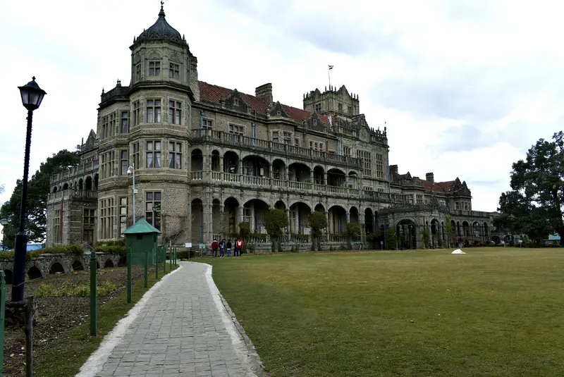 The grey stone Viceregal Lodge in Shimla and its lawns