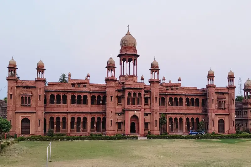 Red brick colonial building with domed towers in Agra