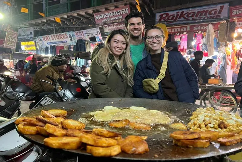 Travellers at a street-food stall in the old city of Agra